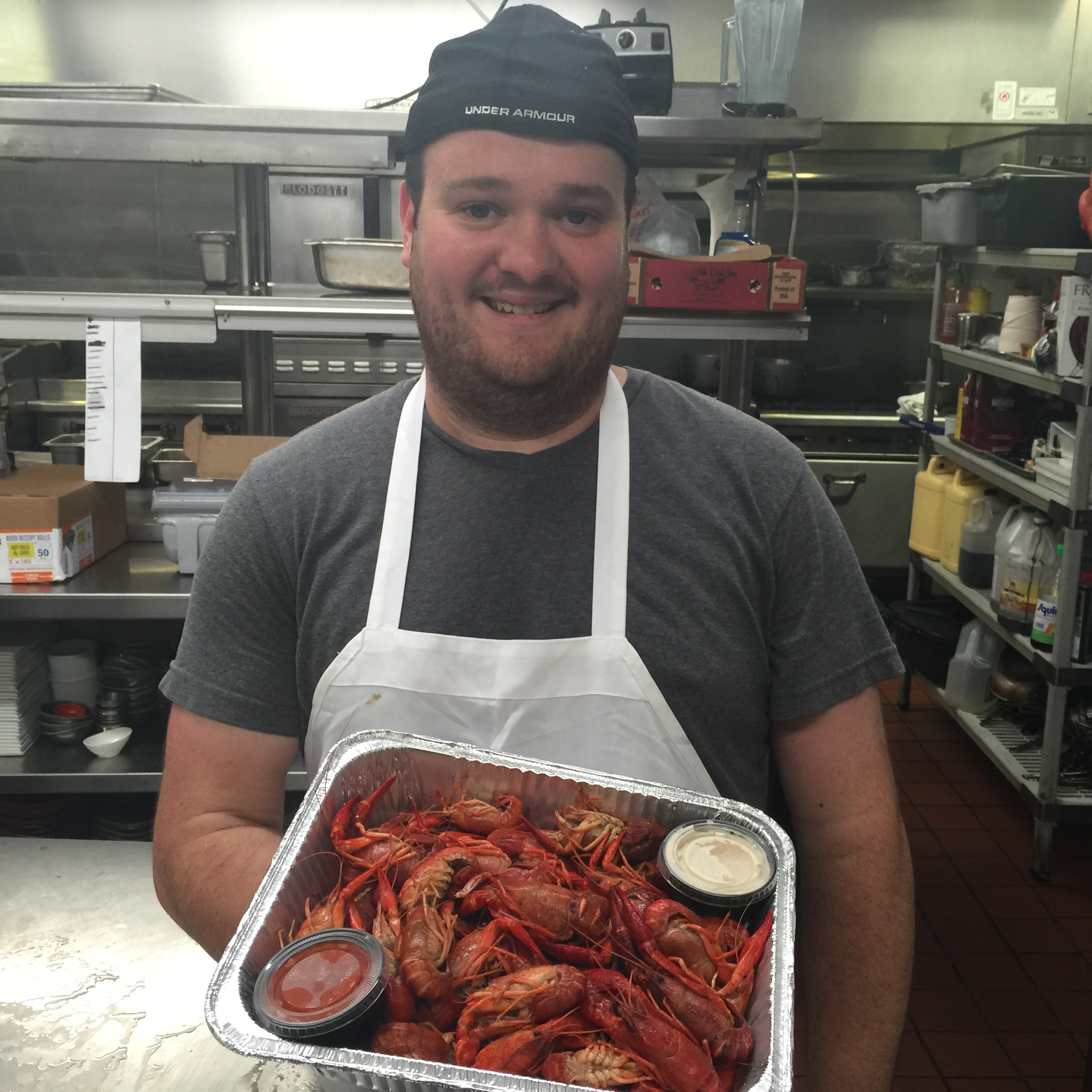 Sous Chef Micheal Brothers with a special get well gift from The Cook and Cork Restaurant 