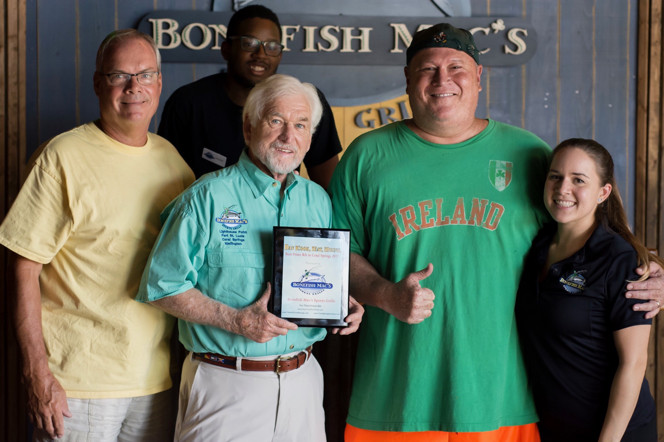Owner Chuck with his award: L to Right: John President of Taste of Coral Springs, Dishane, the Talent, Geri